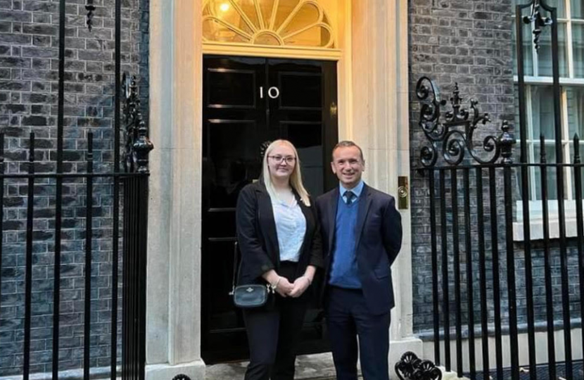 Alun Cairns outside number 10 downing street with Tia