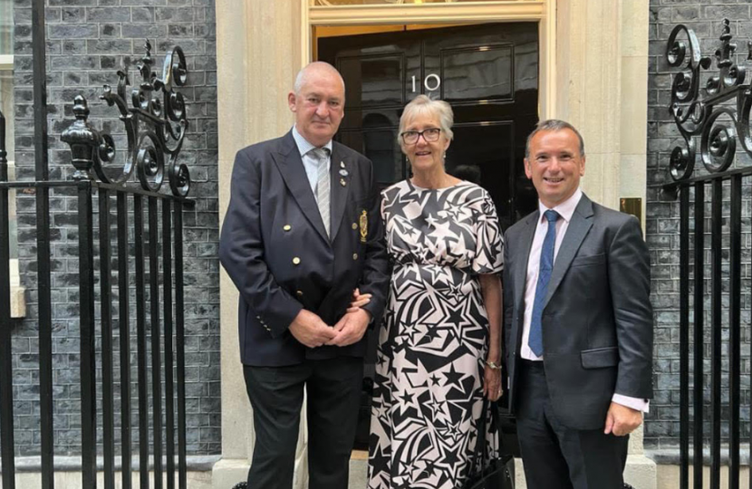 Teresa and Roy Goodwin outside ten downing street with Alun Cairns