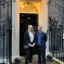 Alun Cairns outside number 10 downing street with Tia