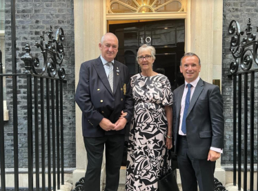 Teresa and Roy Goodwin outside ten downing street with Alun Cairns